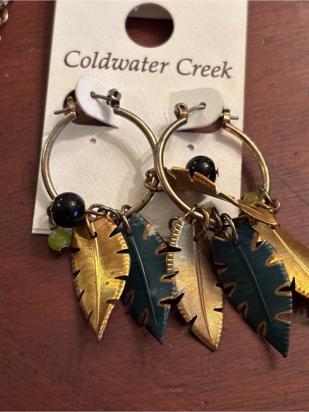 Gold and Teal Feather Hoop Earrings and matching necklace.